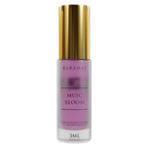 Paarse parfumfles met gouden dop van Musk Bloom Parfumolie - Karamat